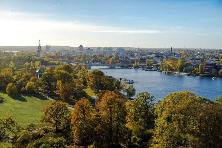 view over town of potsdam from the havel river in germany is one of the best day trips from berlin