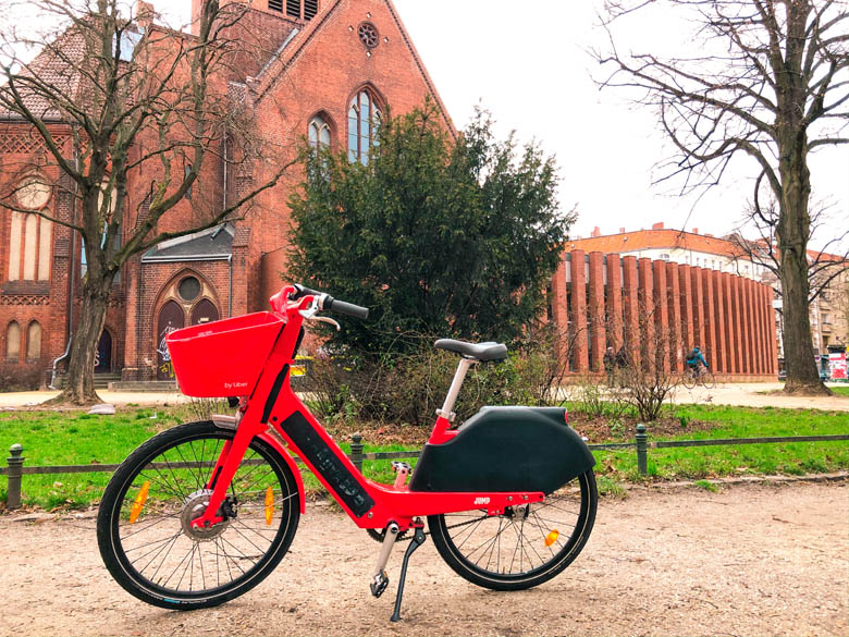 uber jump ebike parked in front of a red church in berlin