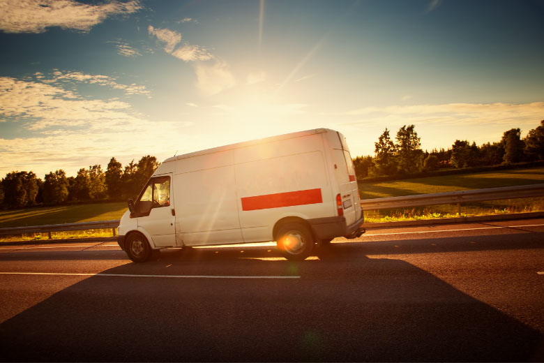 a white transport van for moving furniture to apartments in Germany