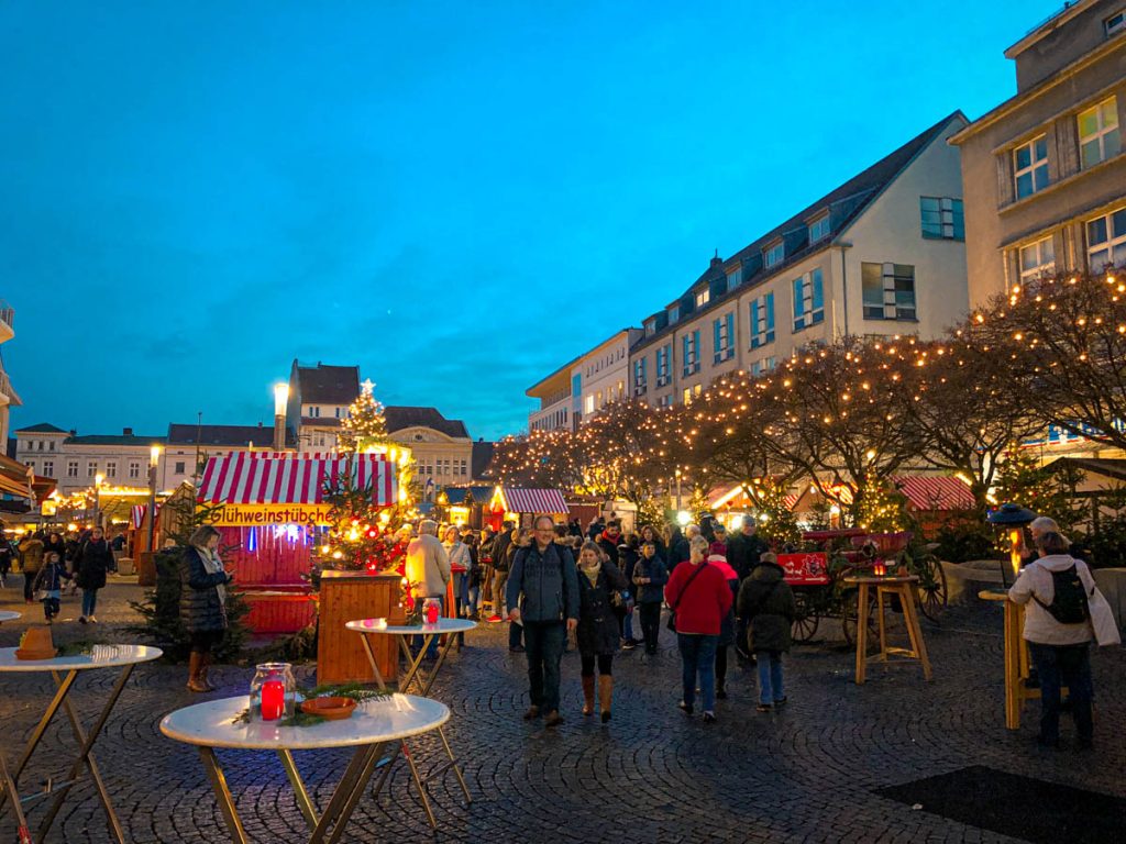 old town spandau with christmas market stalls and fairylights at dusk